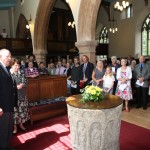 Before the unveiling at the font where Parkes was baptised